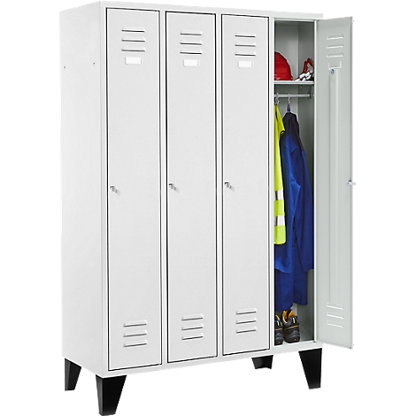White locker with three doors, one door open. Inside the locker: clothes, helmets, and shoes. Black feet.