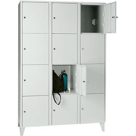 White locker with partially open doors. One contains a bag and a bottle.