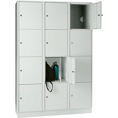 White locker with open doors, showing a black bag and a blue bottle inside.