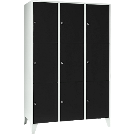 Cabinet with nine compartments. Black doors, white frames and feet. Small silver handles.