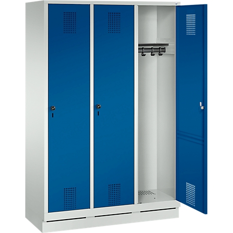 Cabinet with blue doors. One door is open, behind it hooks for clothes.
