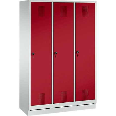 Triple locker with red doors, white frames, and ventilation slots. Each cabinet has a lock.