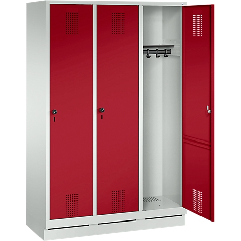 White and red locker, one door open. Red doors with holes, black locks. Hook bar inside.
