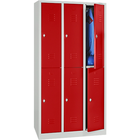 A red locker with six doors, one open. Inside hangs a blue jacket.