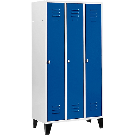 Cabinet with three blue doors, white frame and black legs. Each door has a handle and ventilation slots.
