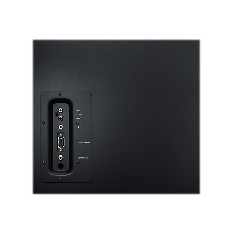 Gros plan de l'arrière d'un haut-parleur noir avec des connecteurs pour différents câbles.