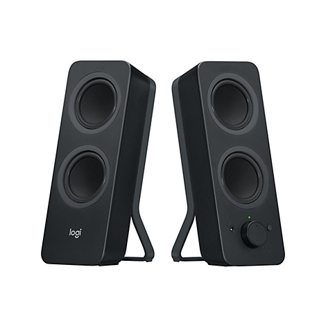 Deux haut-parleurs noirs avec deux haut-parleurs circulaires. Le gauche porte le logo Logitech, le droit un bouton de volume.