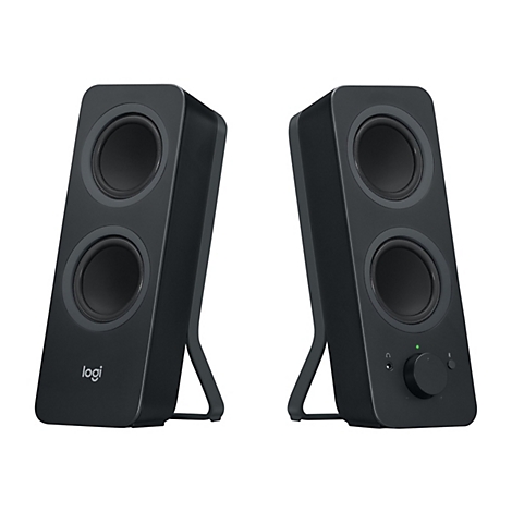 Deux haut-parleurs noirs Logitech sur fond blanc. Le haut-parleur gauche porte le logo Logitech. Le haut-parleur droit est équipé d'une commande de volume et d'une prise casque.
