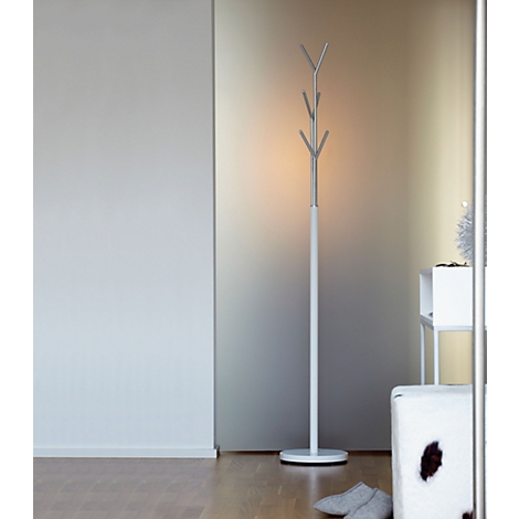 White design coat rack in a modern setting. To the right a stool, to the left a wall. Grey slippers are on the floor.