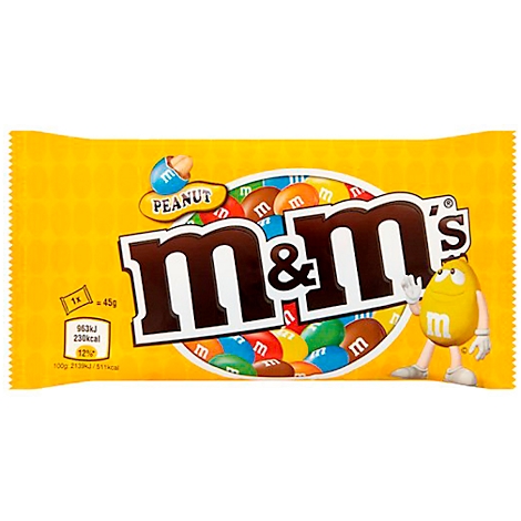 Yellow M&M's package with logo, peanut label and cartoon character. Opened package with colorful chocolate lentils.