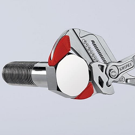 Clé à molette avec poignée rouge fixant une vis brillante.