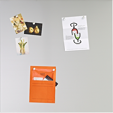 Gray wall with pictures, cards and an orange bag. Cards show fruits, flowers, a drawing. The bag contains notes and a pen.