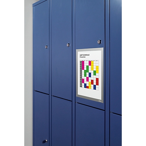 Blue lockers; a shift schedule with colored fields hangs on a locker.