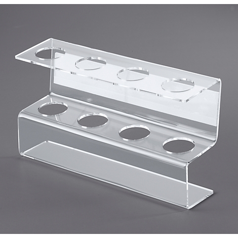 Transparent acrylic ice cream cup holder with holes to place cups. On a gray background.