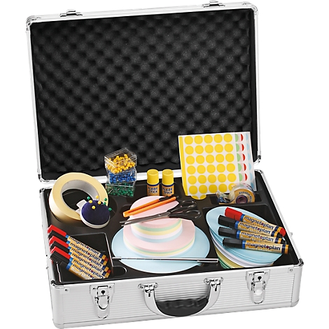 Open silver briefcase with many items: markers, paper clips, tape, papers, pens, scissors.