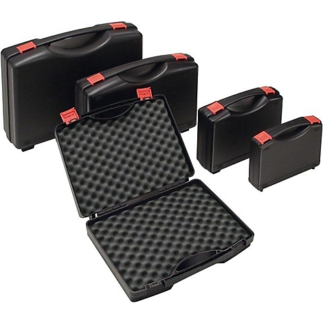 Valises de transport noires de différentes tailles, une valise est ouverte avec un insert en mousse.