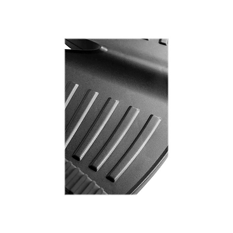 Nahaufnahme einer schwarzen, geriffelten OberflÃ¤che mit rechteckigen Rippen. Die OberflÃ¤che ist leicht angewinkelt und reflektiert das Licht.