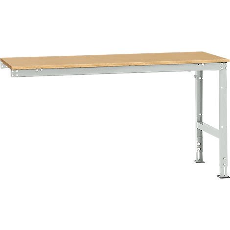 Workbench with wooden top and gray metal frame. On the left the table is attached to the wall, on the right it stands on feet.