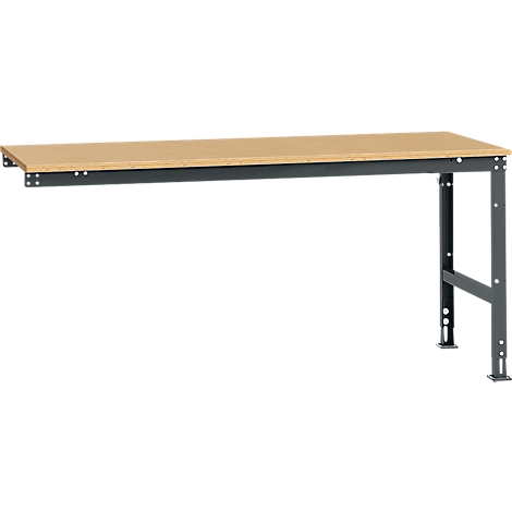 Workbench with wooden top and gray metal frame. The right side is fixed on feet, the left is fixed on a wall.