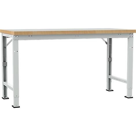 Work bench with light wood top and gray metal frame. The workbench stands on four legs.