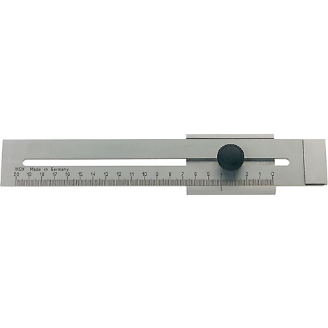 Metal ruler with black knob and cm scale. Inscription: inox made in Germany.