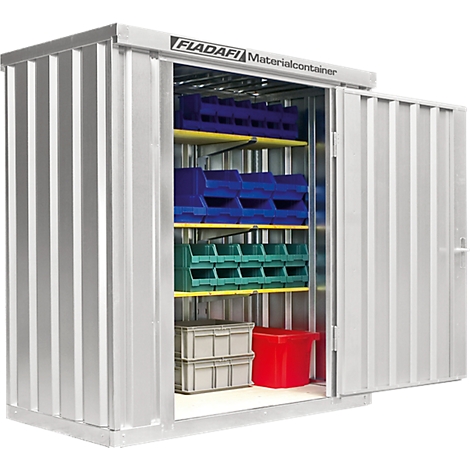 Open metal cabinet with shelves and container boxes. Blue, green, red and gray containers and the inscription "FLADAFI Materialcontainer".