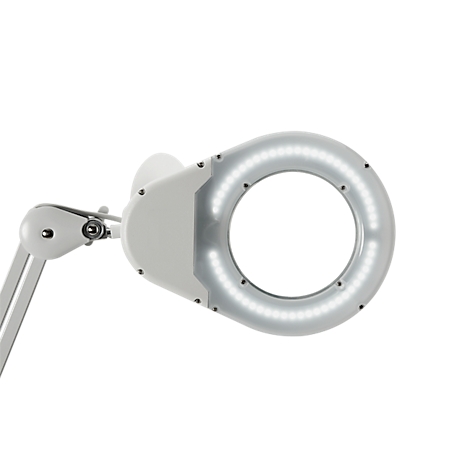 A white magnifying lamp with LED lighting, shot from the side. The focus is on the light circle.