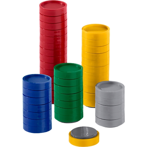 Stacks of multi-colored, round, flat plastic discs standing upright.