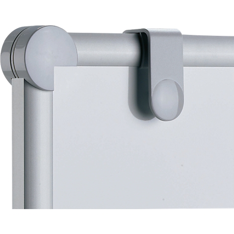 Gray clip element holding a white sheet of paper on a metallic, silver frame.