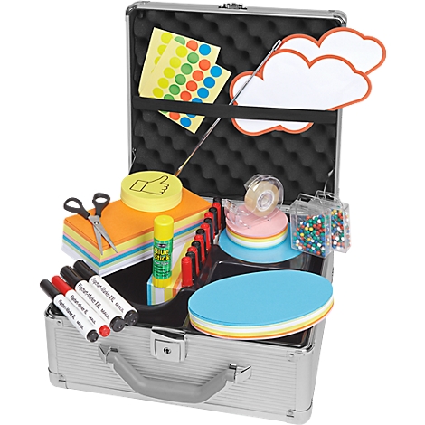 Opened silver case filled with paper, pens, glue, scissors, tape, and cloud shapes.