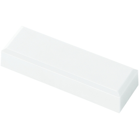 White, rectangular object with slanted edges, viewed slightly from above.