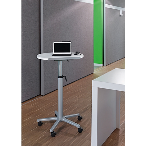 A white height-adjustable table with a laptop, set against a gray background. Wheels at the base.