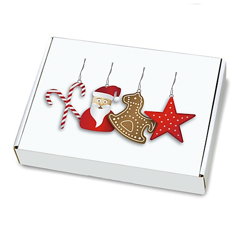 Weißer Karton mit Weihnachtsdeko: Zuckerstange, Weihnachtsmann, Lebkuchenpferd, Stern.