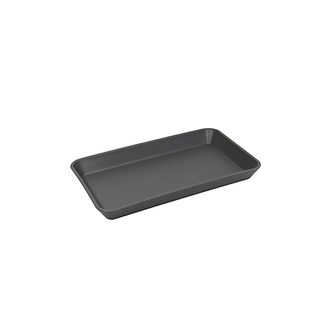 Plaque de cuisson rectangulaire gris foncé, prise de vue légèrement en diagonale par le haut.