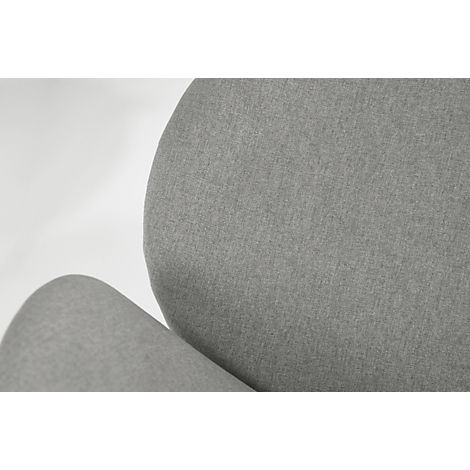 Gros plan sur un tissu gris clair, peut-être le rembourrage d'une chaise. La lumière vient de la gauche.