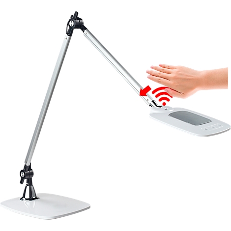 Een witte bureaulamp wordt bediend met een hand die zich in de buurt van de leeskop bevindt. Radiogolven symboliseren bediening.