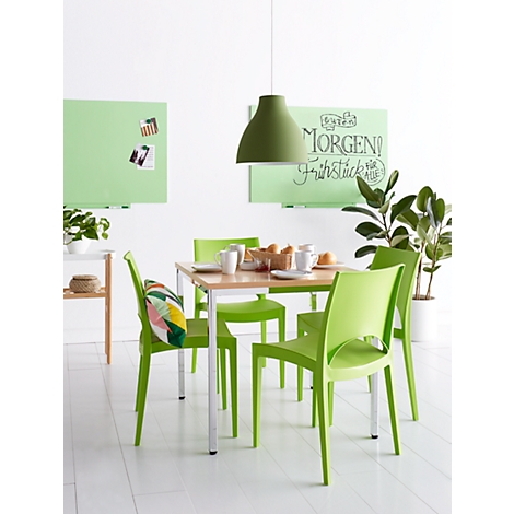 Dining room with green chairs, table, and lamp. On the table: breakfast with the inscription: Good morning!