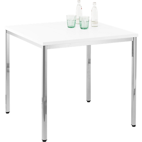 Square white table with metal legs. Two green glasses and two water bottles are on it.