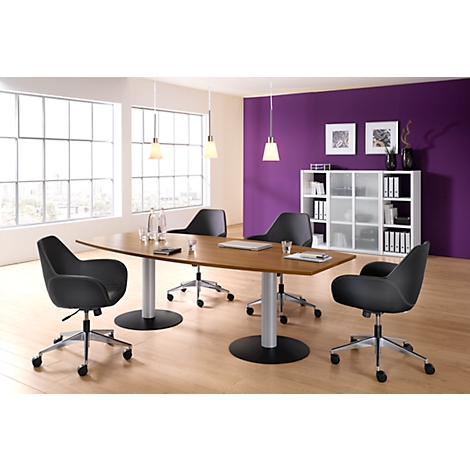 Conference table with black chairs, in a modern office. The background is partially purple.
