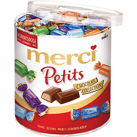 Vorratsdose mit bunten merci Petits Schokoladenbonbons.