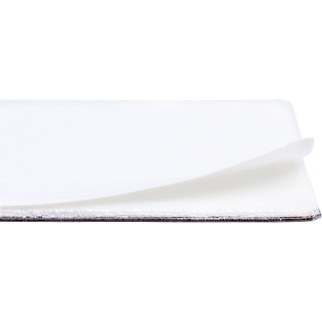 Close-up of a white card, lifting from the edge, showing another card underneath.