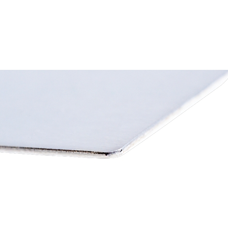 Close-up of a white, smooth surface with a rounded corner. The edge is dark-colored.