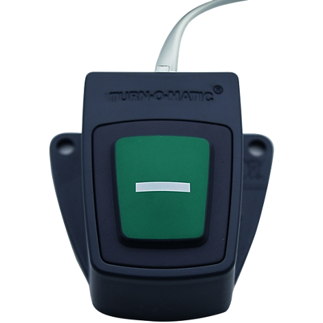 Black button with green button in center, white bar. Cable connection.