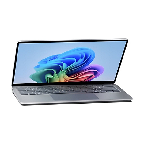 Graues Laptop-Modell. Auf dem Bildschirm ein farbenfrohes Design.