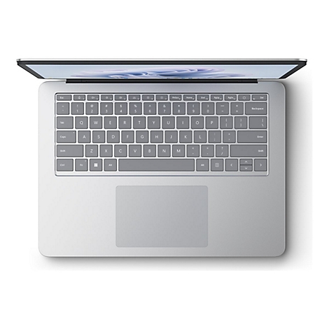 Graues Laptop von oben, Tasten und Touchpad deutlich erkennbar.