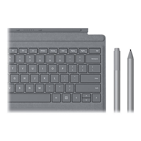 Clavier et stylet gris à côté d'une tablette. Accent sur les touches et la pointe du stylet.