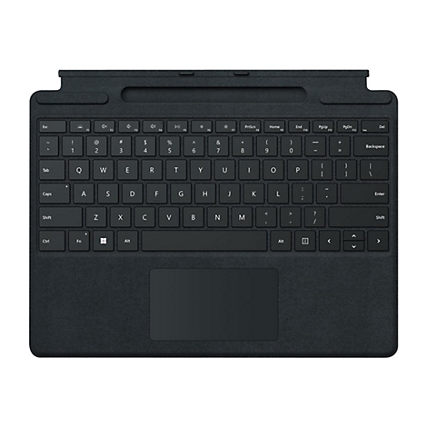 Clavier sombre posé à plat sur une surface. Il y a une zone de pavé tactile et les touches alphanumériques habituelles.