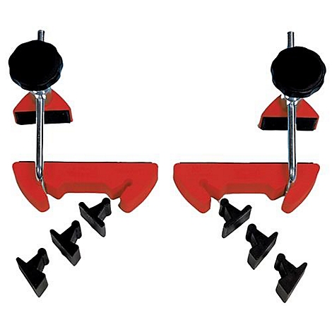 Two red and black clamps with black knobs. Next to them are black plastic parts.