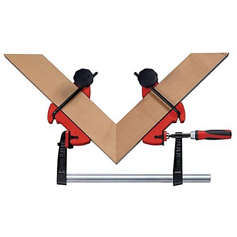 Two pieces of wood are fixed at a 90-degree angle by a red and black corner clamp.