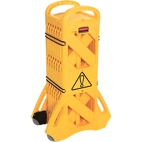 Yellow barrier with wheels and handle. Warning triangle with exclamation mark. Black tension straps hold the construction together.